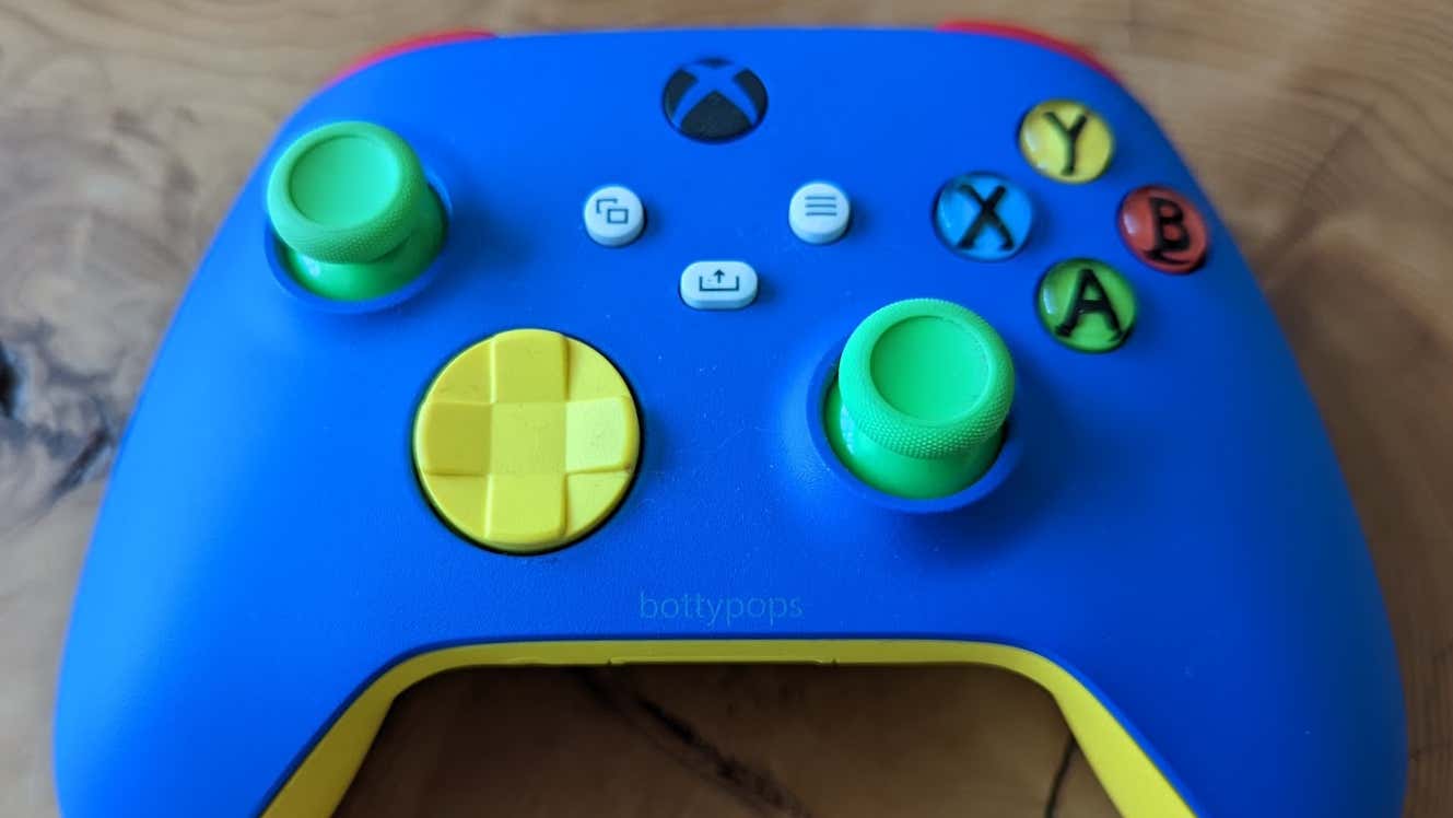 The world's most beautiful Xbox controller in yellow, red, blue, and green.